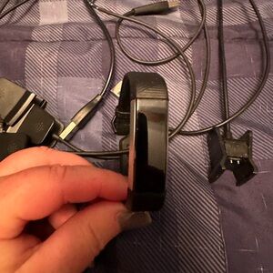 Fitbit Alta HR with three chargers